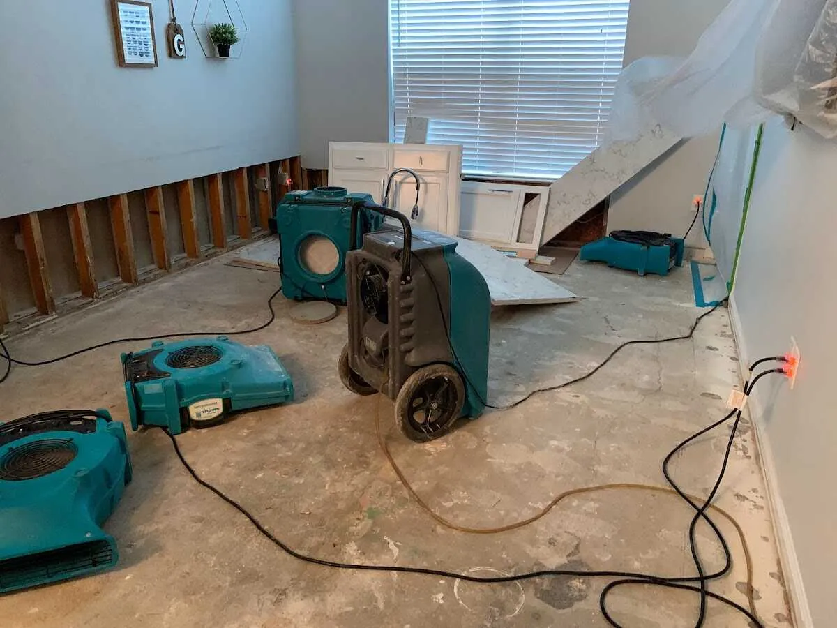 Dehumidifier in flood-cut room for Water Damage Restoration in Louisburg